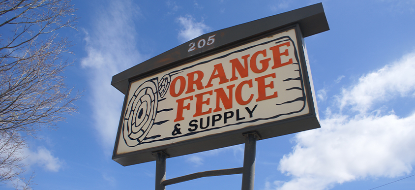 orange fence company sign outside