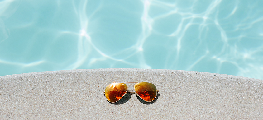 sunglasses by pool