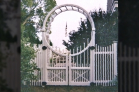 white arbor in a garden